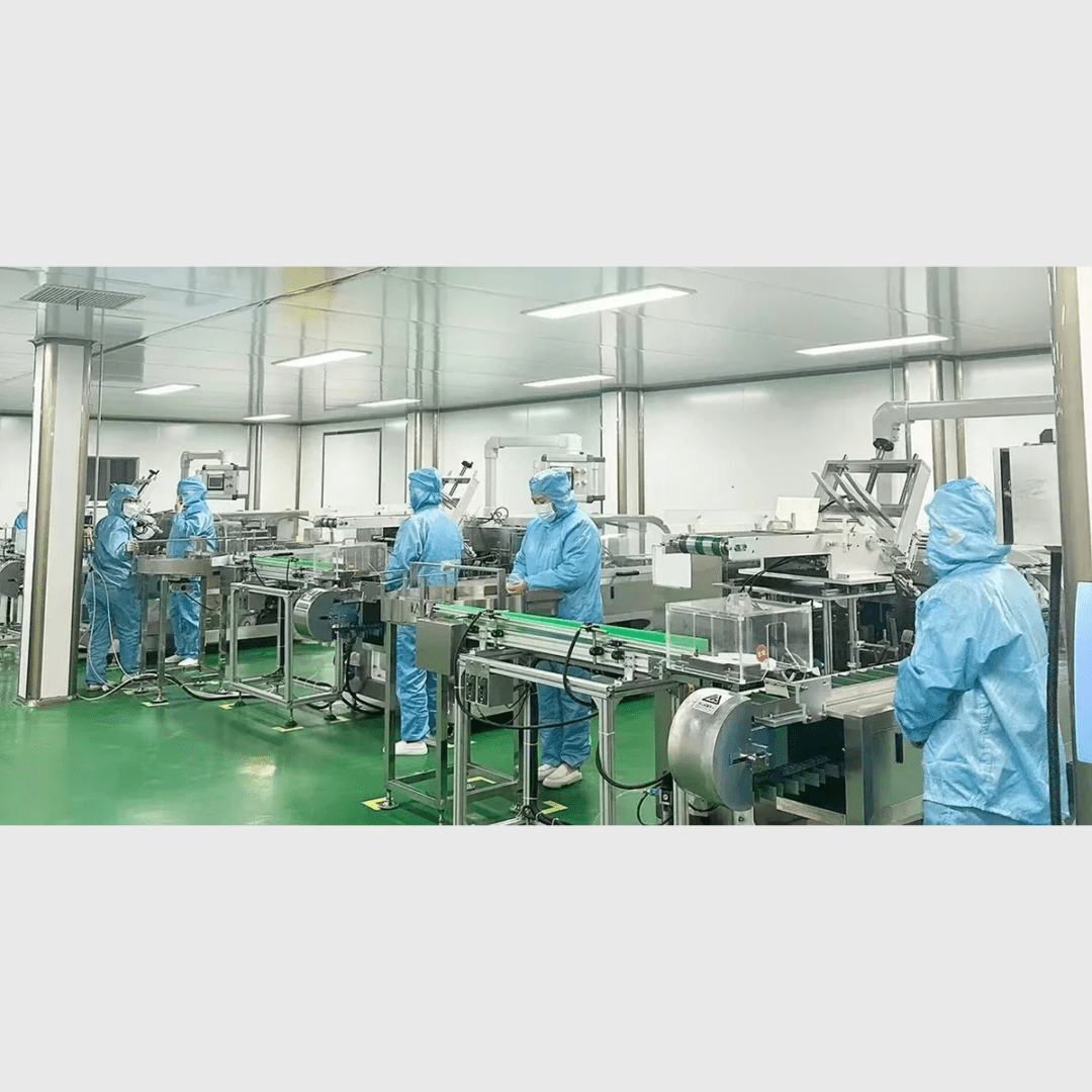 Industrial cleanroom with workers in blue attire