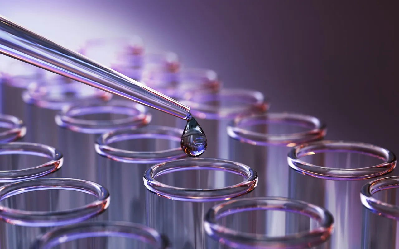 Laboratory pipette above glass test tubes