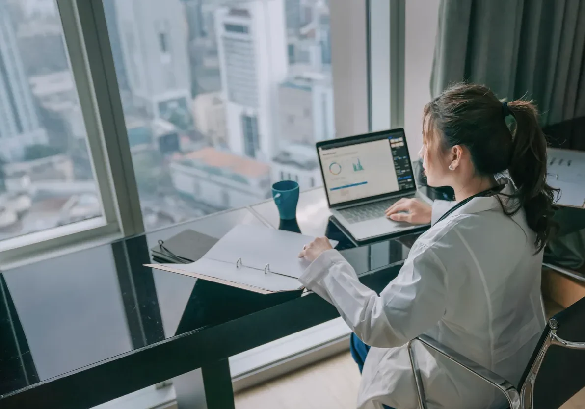 Professional analyzing data at desk