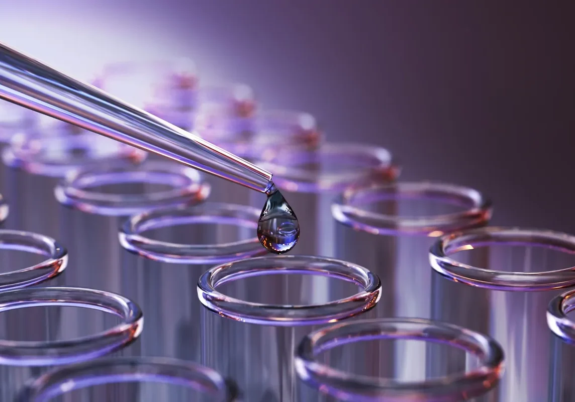 Laboratory pipette above glass test tubes