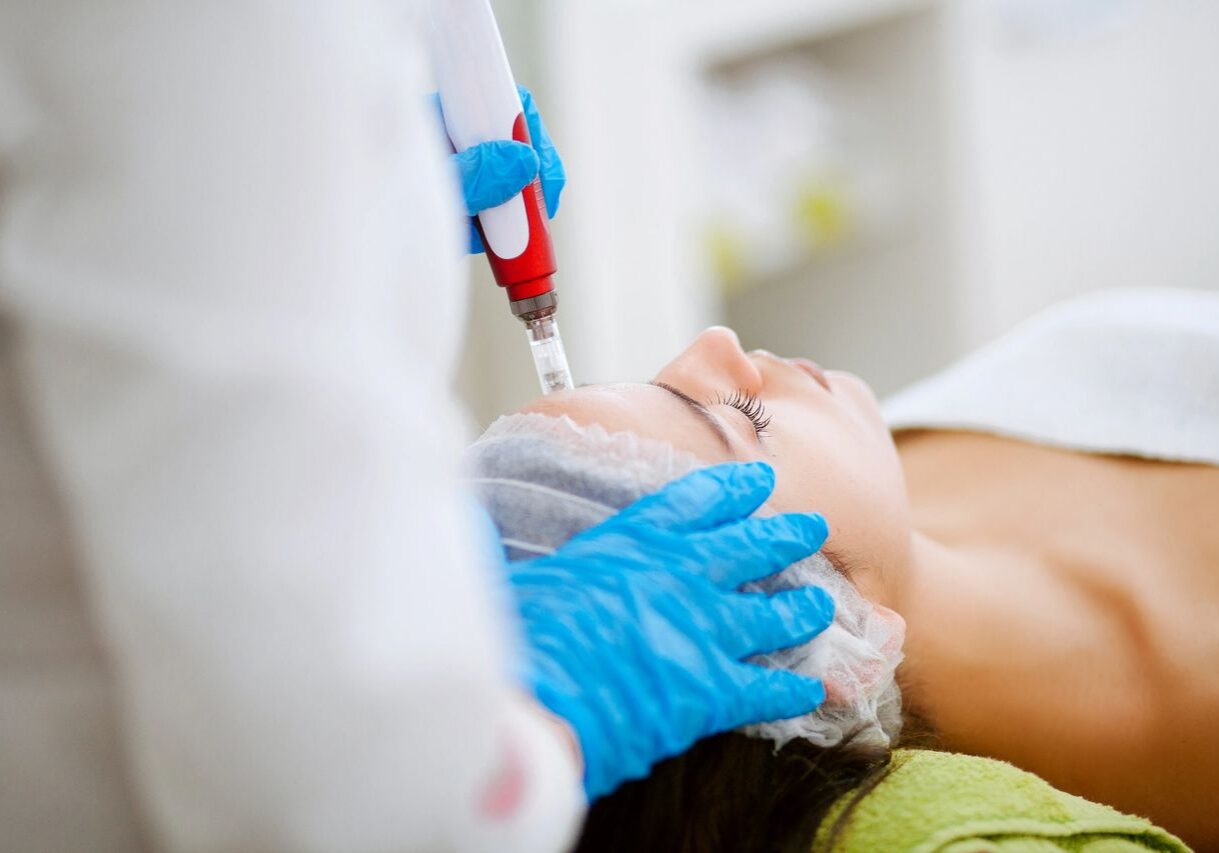 Woman receiving professional facial care
