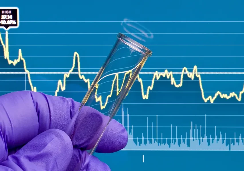 Lab analysis concept with financial graph overlay.