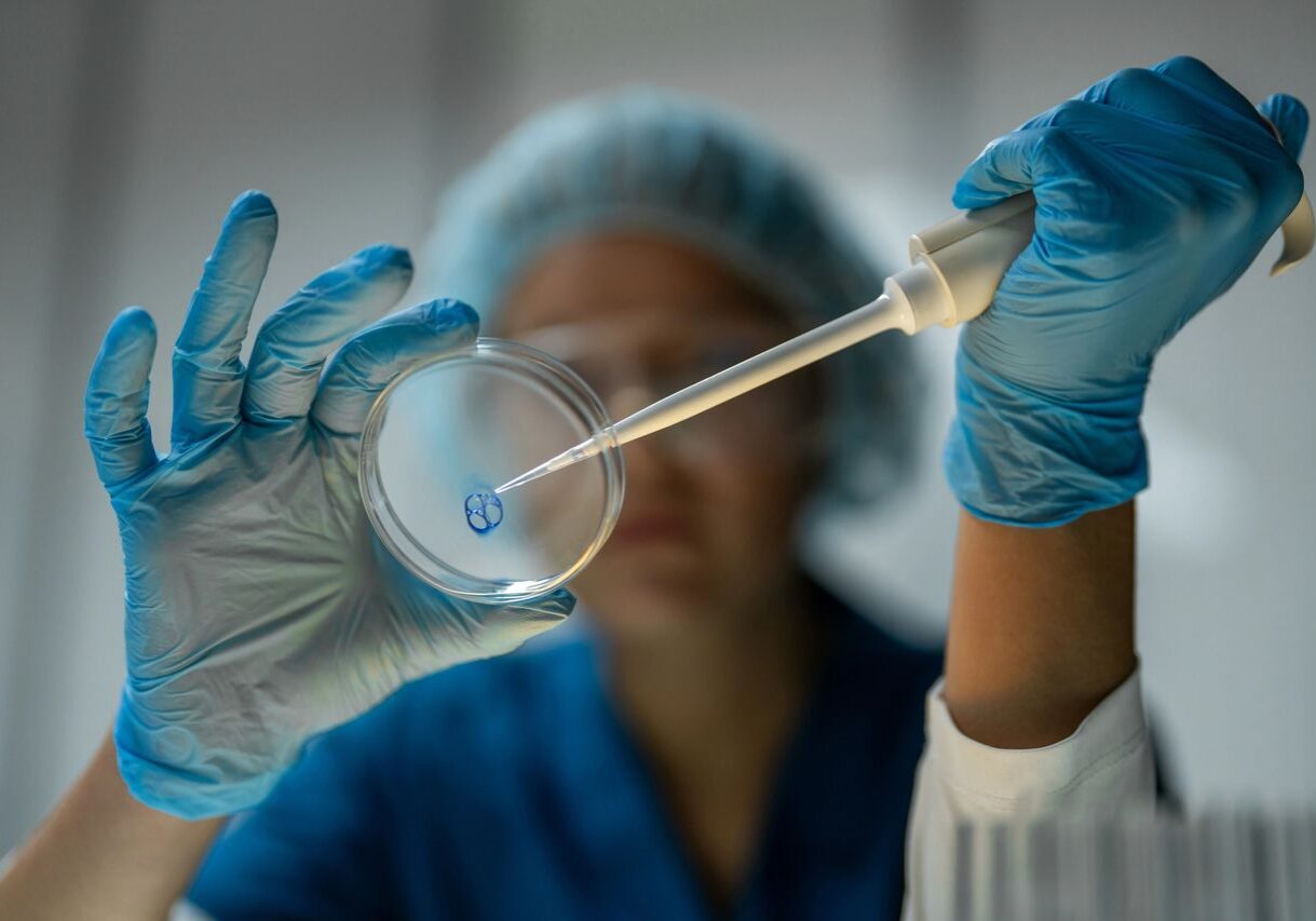 Lab technician handling scientific equipment